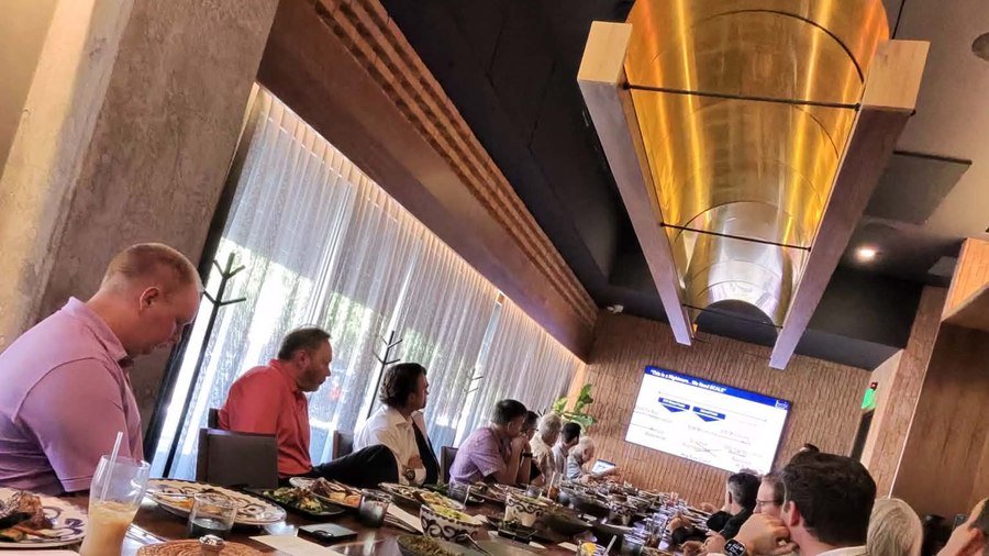 Board Friends Events corporate gathering — long dining table with guests at an elevated dinner experience