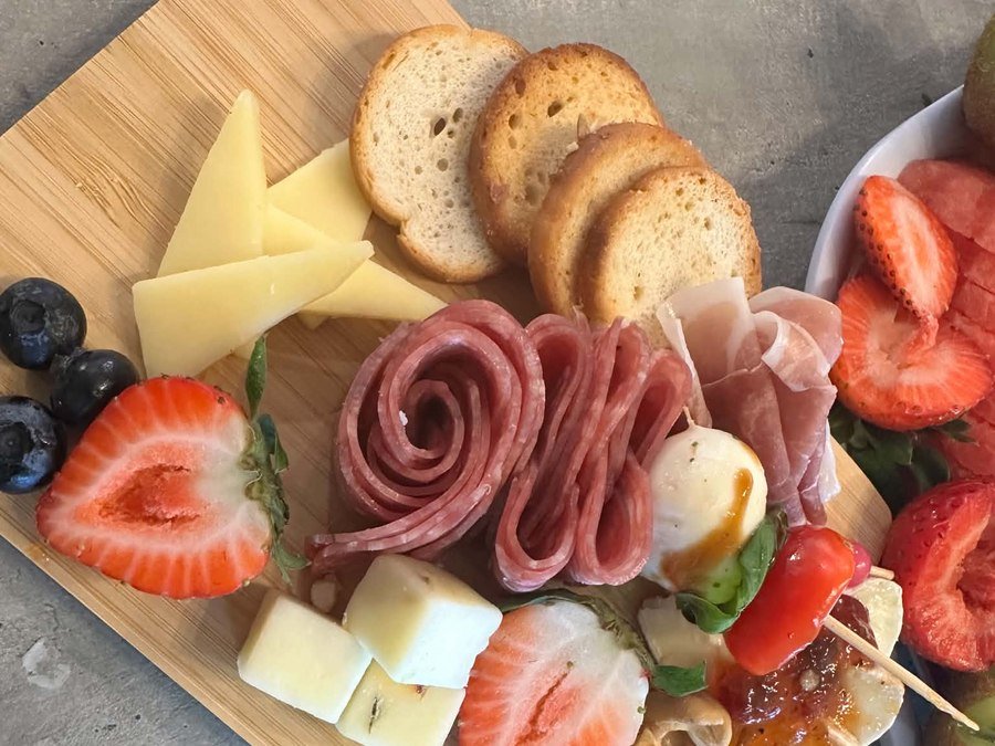 Board Friends Events individual grazing box — charcuterie with meats, cheeses, fruits and crostini